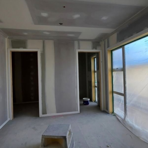 Plastering work creating a smooth wall finish